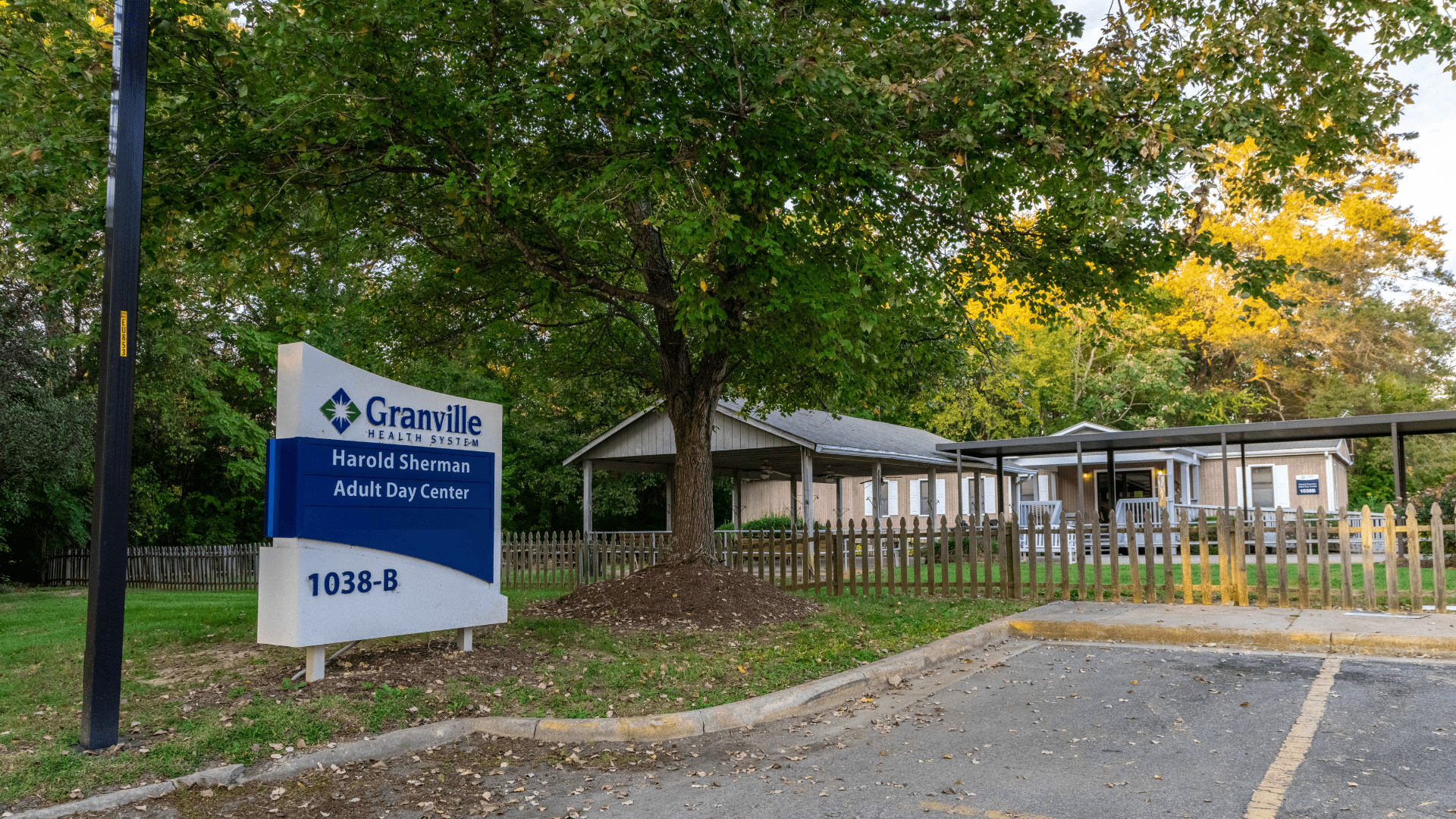 Exterior shot of the front of Granville Health System's Harold Sherman Adult Care Center with sign displaying the center's name