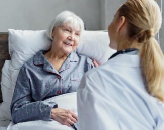 Doctor comforting elderly patient | Granville Health System