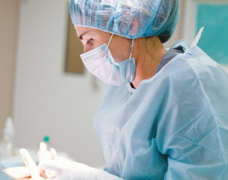 Surgeon in surgical gear preparing for operation | Granville Health System