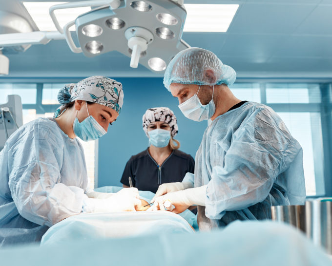 Surgeons performing abdominoplasty surgery in a modern hospital | Granville Health System