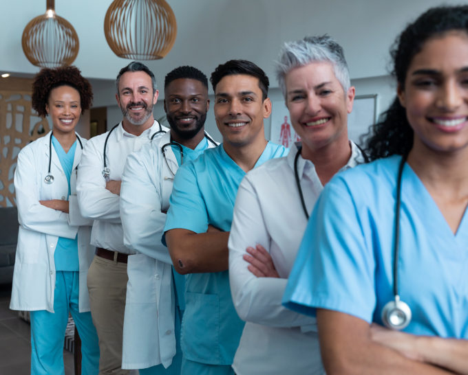 Portrait of group of diverse male and female doctors standing in