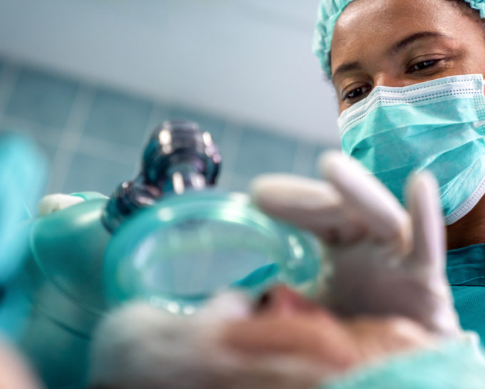 Anesthesiologist adjusting valves