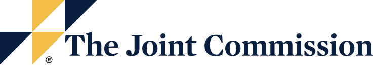 The Joint Commission Logo - Navy blue serif type with blue and yellow triangles to left