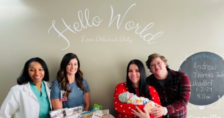 Pictured from L to R in the attached photo: Dr. LaKeya Russell, OB/GYN and Ashley Currin, BSN, RNC-OB, Hailey Woodlief (mom), Andrew Thomas Woodlief (baby), and Andy Woodlief (dad).)