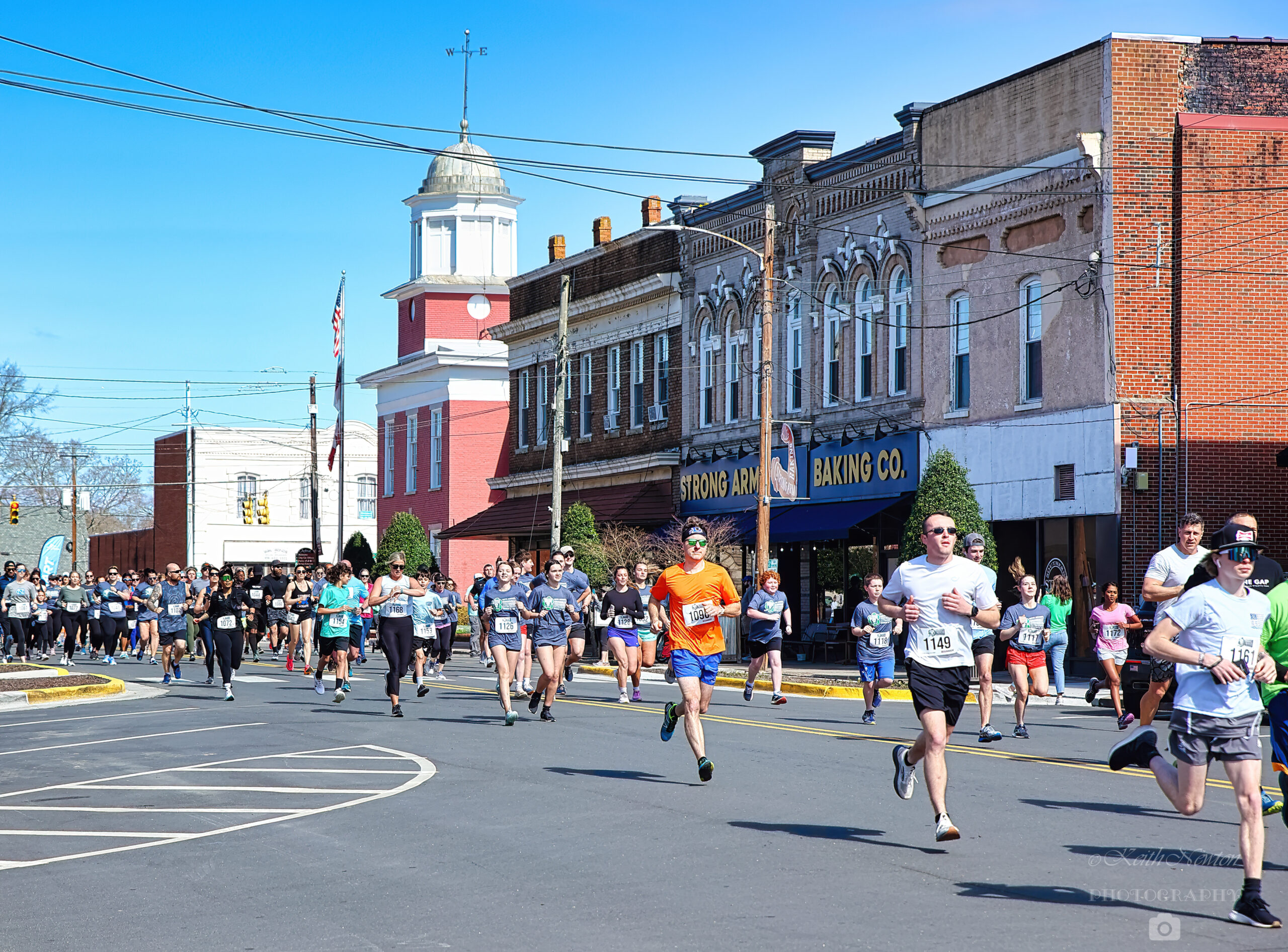 Runners running down street during the Granville Ambulance Chase